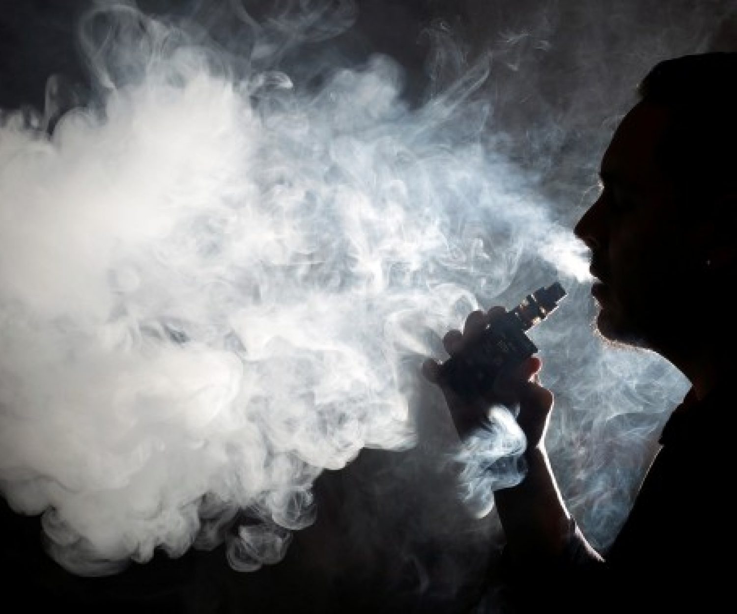 smoker silhouette vaping blowing big smoke cloud