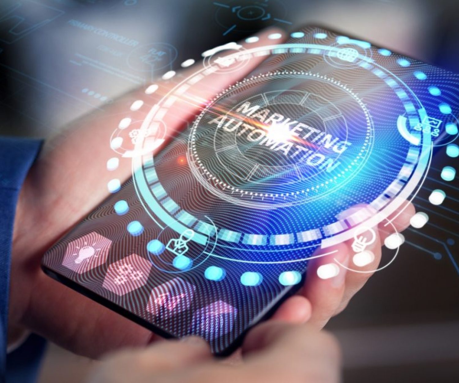 man holding tablet with marketing automation on screen