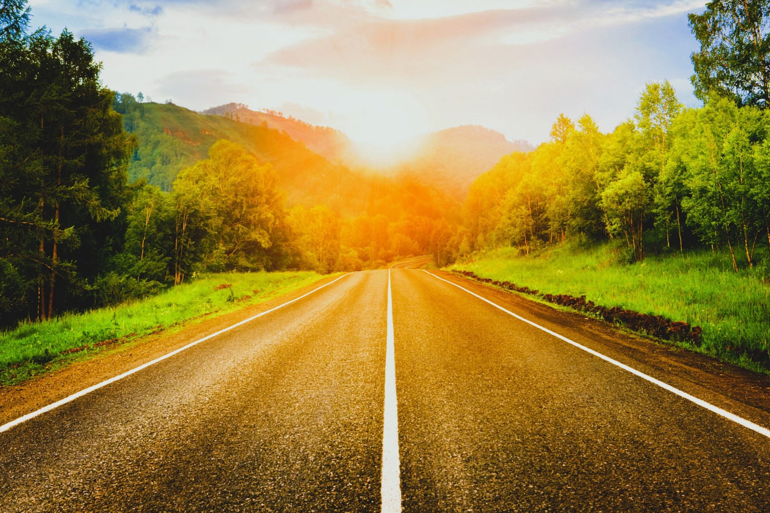 Road leading into sunset