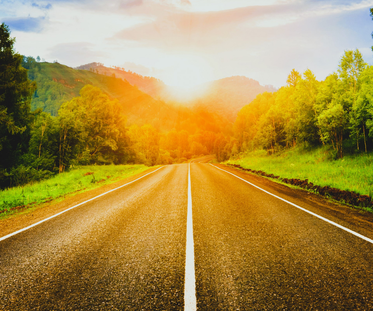 Road leading into sunset